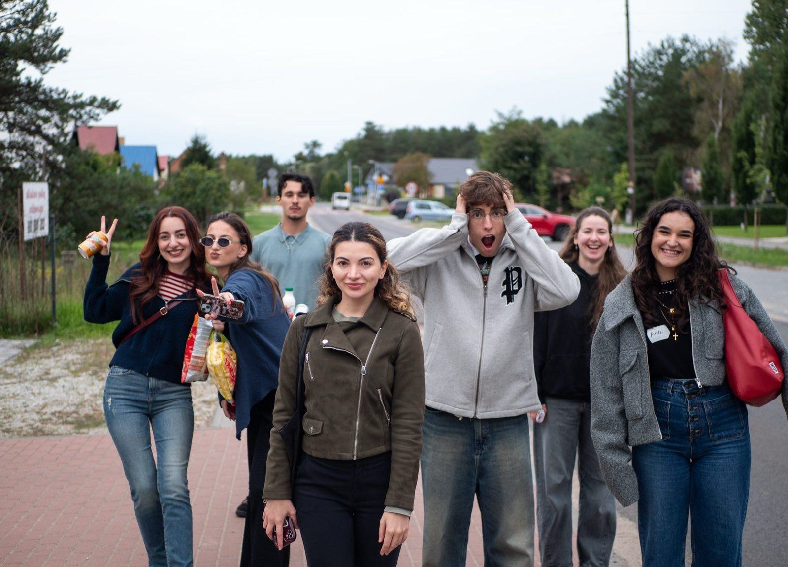Eight young people from Youth for Change walking together and laughing during a project abroad