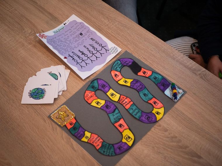 A board game the participants made by hand, with cards and a playing track drawn on card